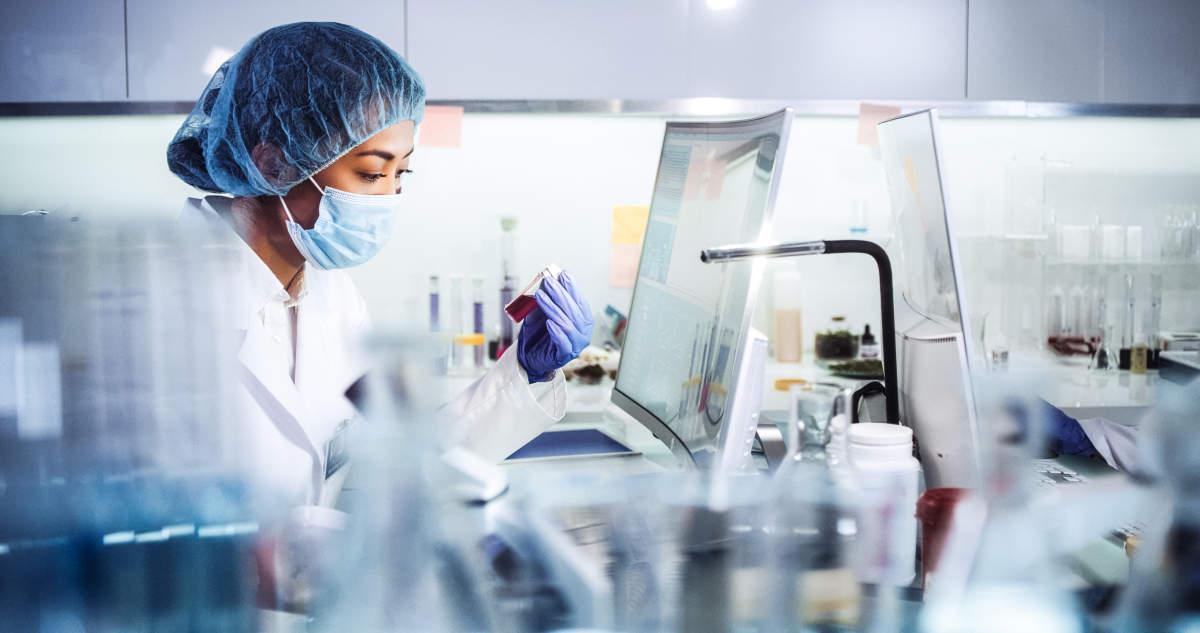 woman in a lab with mask on